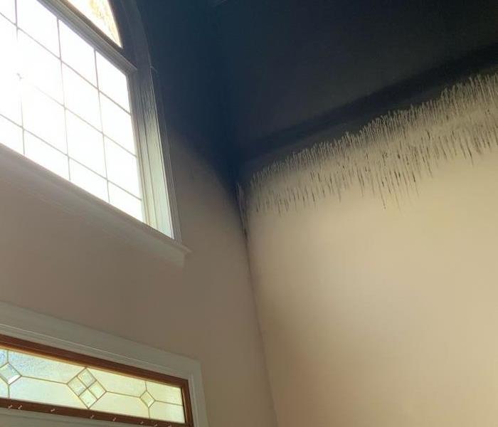 Soot Damage to tops of walls in foyer