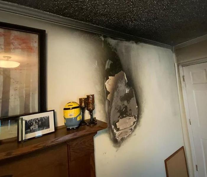 bedroom wall burned from fire cause of loss