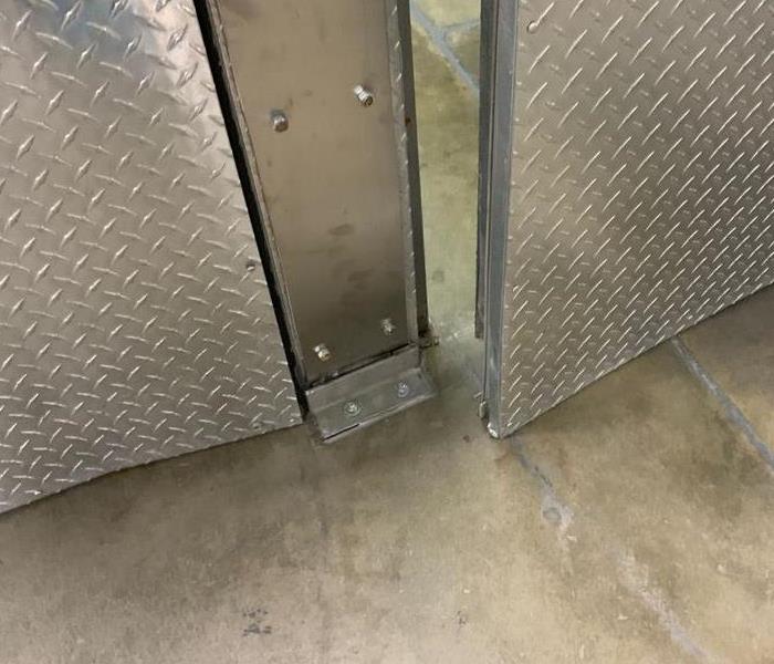 photo of a cooler with a damaged door